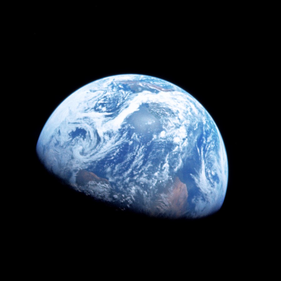 Earth rising over the lunar horizon, photographed from Apollo 8.